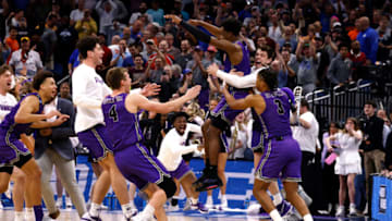 ORLANDO, FL - MARCH 16: Players of the Furman Paladins celebrate their 68-67 victory against the Virginia Cavaliers in the first round of the NCAA Men's Basketball Tournament at Amway Center on March 16, 2023 in Orlando, Florida. (Photo by Lance King/Getty Images)