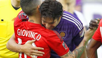 Apr 26, 2015; Orlando, FL, USA; Orlando City FC midfielder Kaka and Toronto FC midfielder Sebastian Giovinco (10) hug at midfield before an MLS soccer match at Orlando Citrus Bowl Stadium. Mandatory Credit: Reinhold Matay-USA TODAY Sports