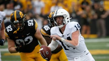 Penn State senior quarterback Sean Clifford scrambles for a first down in the second quarter against Iowa at Kinnick Stadium in Iowa City, Iowa, on Saturday, Oct. 9, 2021.20211009 Iowavspennstate
