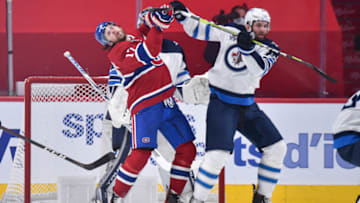 MONTREAL, QC - JUNE 06: Josh Anderson #17 of the Montreal Canadiens and Derek Forbort #24 of the Winnipeg Jets battle for position during the first period in Game Three of the Second Round of the 2021 Stanley Cup Playoffs at the Bell Centre on June 6, 2021 in Montreal, Canada. (Photo by Minas Panagiotakis/Getty Images)