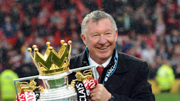 CROPPED VERSIONManchester United's Scottish manager Alex Ferguson kisses the Premier League trophy at the end of the English Premier League football match between Manchester United and Swansea City at Old Trafford in Manchester, northwest England, on May 12, 2013. Ferguson said farewell to Old Trafford with a typically passionate speech after his side's 2-1 victory over Swansea in his final home match in charge of the team. AFP PHOTO / ANDREW YATESRESTRICTED TO EDITORIAL USE. No use with unauthorized audio, video, data, fixture lists, club/league logos or “live” services. Online in-match use limited to 45 images, no video emulation. No use in betting, games or single club/league/player publications (Photo credit should read ANDREW YATES/AFP via Getty Images)