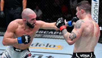 LAS VEGAS, NEVADA - OCTOBER 02: In this handout photo provided by UFC, (L-R) Jared Gordon punches Joe Solecki in their lightweight bout during the UFC Fight Night event at UFC APEX on October 02, 2021 in Las Vegas, Nevada. (Photo by Jeff Bottari/Zuffa LLC via Getty Images)