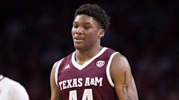 FAYETTEVILLE, AR - FEBRUARY 17: Robert Williams #44 of the Texas A&M Aggies walks down the court with a smile during a game against the Arkansas Razorbacks at Bud Walton Arena on February 17, 2018 in Fayetteville, Arkansas. The Razorbacks defeated the Aggies 94-75. (Photo by Wesley Hitt/Getty Images)
