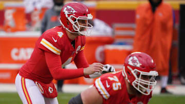 Jan 17, 2021; Kansas City, Missouri, USA; Kansas City Chiefs quarterback Chad Henne (4) takes the snap against the Cleveland Browns during the second half in the AFC Divisional Round playoff game at Arrowhead Stadium. Mandatory Credit: Denny Medley-USA TODAY Sports