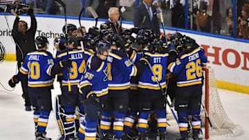 Apr 25, 2016; St. Louis, MO, USA; St. Louis Blues teammates celebrate after defeating the Chicago Blackhawks 3-2 in game seven of the first round of the 2016 Stanley Cup Playoffs at Scottrade Center. Mandatory Credit: Jasen Vinlove-USA TODAY Sports
