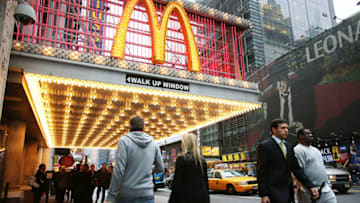NEW YORK, NY - DECEMBER 10: People walk past a McDonald's restaurant in Times Square on December 10, 2012 in New York City. In a surprise to Wall Street, the U.S. fast food establishment reported U.S. same store sales up 2.5 percent for November. Sales rose 0.6 percent in the chain's Asia/Pacific, Middle East and Africa division, while in Europe, same store sales grew 1.4 percent. (Photo by Spencer Platt/Getty Images)