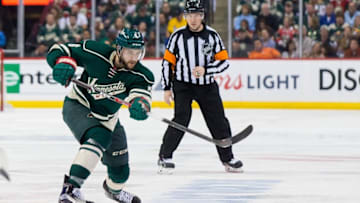 Apr 20, 2016; Saint Paul, MN, USA; Minnesota Wild defenseman Marco Scandella (6) dumps the puck in the second period against the Dallas Stars in game four of the first round of the 2016 Stanley Cup Playoffs at Xcel Energy Center. Mandatory Credit: Brad Rempel-USA TODAY Sports