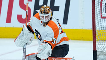 Apr 19, 2022; Toronto, Ontario, CAN; Philadelphia Flyers goaltender Felix Sandstrom (32) makes a save during warm up before a game against the Toronto Maple Leafs at Scotiabank Arena. Mandatory Credit: John E. Sokolowski-USA TODAY Sports