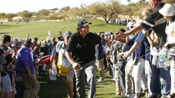 Feb 5, 2016; Scottsdale, AZ, USA; Phil Mickelson walks off the 9th green to cheers from the gallery during the second round of the Waste Management Phoenix Open golf tournament at TPC Scottsdale. Mandatory Credit: Rob Schumacher/The Arizona Republic via USA TODAY NETWORK