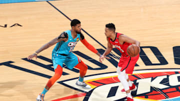 Paul George of the OKC Thunder defends CJ McCollum (Photo by Joe Murphy/NBAE via Getty Images)