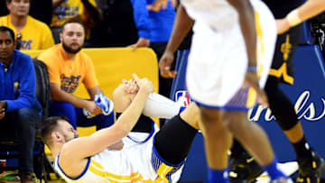 Jun 13, 2016; Oakland, CA, USA; Golden State Warriors center Andrew Bogut (12) reacts after being injured during the third quarter against the Cleveland Cavaliers in game five of the NBA Finals at Oracle Arena. Mandatory Credit: Bob Donnan-USA TODAY Sports