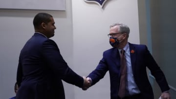Jan 31, 2022; Lake Forest, IL, USA; Chicago Bears Chairman George McCaskey (right) shakes hands with Bears new General Manager Ryan Poles (left) at a Press Conference to introduce new Chicago Bears-Head Coach Matt Eberflus Mandatory Credit: David Banks-USA TODAY Sports