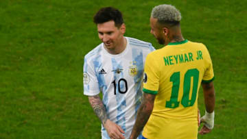 Argentina's Lionel Messi (L) and Brazil's Neymar joke during the Conmebol 2021 Copa America football. (Photo by MAURO PIMENTEL/AFP via Getty Images)