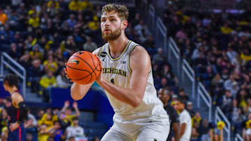 ANN ARBOR, MICHIGAN - NOVEMBER 23: Hunter Dickinson #1 of the Michigan Wolverines shoots a free throw during the second half of a college basketball game against the Jackson State Tigers at Crisler Arena on November 23, 2022 in Ann Arbor, Michigan. The Michigan Wolverines won the game 78-68 over the Jackson State Tigers. (Photo by Aaron J. Thornton/Getty Images)