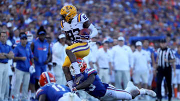 GAINESVILLE, FL - OCTOBER 07: Russell Gage #83 of the LSU Tigers attempts to run past Chauncey Gardner Jr. #23 of the Florida Gators during the game at Ben Hill Griffin Stadium on October 7, 2017 in Gainesville, Florida. (Photo by Sam Greenwood/Getty Images)