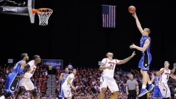 Mar 31, 2013; Indianapolis, IN, USA; Duke Blue Devils forward Mason Plumlee (5) shoots against the Louisville Cardinals during the Midwest regional of the 2013 NCAA tournament against the Duke Blue Devils at Lucas Oil Stadium. Louisville won 85-63. Mandatory Credit: Jamie Rhodes-USA TODAY Sports