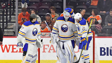 Apr 1, 2023; Philadelphia, Pennsylvania, USA; Buffalo Sabres goaltender Devon Levi (27), goaltender Ukko-Pekka Luukkonen (1) and right wing Kyle Okposo (21) celebrate win against the Philadelphia Flyers during the third period at Wells Fargo Center. Mandatory Credit: Eric Hartline-USA TODAY Sports