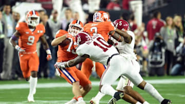 Jan 11, 2016; Glendale, AZ, USA; Clemson Tigers wide receiver Hunter Renfrow (13) is tackled by Alabama Crimson Tide linebacker Reuben Foster (10) in the first quarter in the 2016 CFP National Championship at University of Phoenix Stadium. Mandatory Credit: Matt Kartozian-USA TODAY Sports