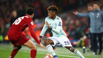 LIVERPOOL, ENGLAND - FEBRUARY 19: Kingsley Coman of Bayern Munich takes on Trent Alexander-Arnold of Liverpool during the UEFA Champions League Round of 16 First Leg match between Liverpool and FC Bayern Muenchen at Anfield on February 19, 2019 in Liverpool, England. (Photo by Clive Brunskill/Getty Images)