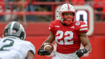 LINCOLN, NE - NOVEMBER 17: Running back Devine Ozigbo #22 of the Nebraska Cornhuskers runs against the Michigan State Spartans in the first half at Memorial Stadium on November 17, 2018 in Lincoln, Nebraska. (Photo by Steven Branscombe/Getty Images)