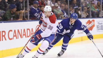 Oct 2, 2016; Toronto, Ontario, CAN; Montreal Canadiens forward Nikita Scherbak (38) skates with the puck as Toronto Maple Leafs center William Nylander (29) puts pressure on him during a preseason hockey game at Air Canada Centre. The Maple Leafs beat the Canadiens 3-2 in overtime. Mandatory Credit: Tom Szczerbowski-USA TODAY Sports