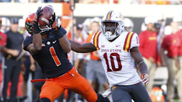 Oct 8, 2016; Stillwater, OK, USA; Oklahoma State Cowboys wide receiver Jalen McCleskey (1) makes a catch ahead of Iowa State Cyclones defensive back Brian Peavy (10) during the second half at Boone Pickens Stadium. Oklahoma State won 38-31. Mandatory Credit: Alonzo Adams-USA TODAY Sports