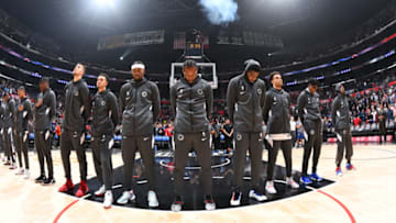 LOS ANGELES, CA - NOVEMBER 11: The LA Clippers stand for the National Anthem prior to the game against the Toronto Raptors on November 11, 2019 at STAPLES Center in Los Angeles, California. NOTE TO USER: User expressly acknowledges and agrees that, by downloading and/or using this Photograph, user is consenting to the terms and conditions of the Getty Images License Agreement. Mandatory Copyright Notice: Copyright 2019 NBAE (Photo by Adam Pantozzi/NBAE via Getty Images)