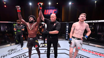 LAS VEGAS, NEVADA - JUNE 06: In this handout image provided by UFC, Aljamain Sterling celebrates after his submission victory over Cory Sandhagen in their bantamweight bout during the UFC 250 event at UFC APEX on June 06, 2020 in Las Vegas, Nevada. (Photo by Jeff Bottari/Zuffa LLC via Getty Images)