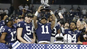 Dec 28, 2019; Arlington, Texas, USA; Penn State Nittany Lions linebacker Micah Parsons (11) holds up the most outstanding defensive player award after the game against the Memphis Tigers at AT&T Stadium. Mandatory Credit: Tim Heitman-USA TODAY Sports