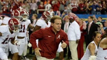 Dec 6, 2014; Atlanta, GA, USA; Alabama Crimson Tide head coach Nick Saban leads his team on the field prior to facing the Missouri Tigers in the 2014 SEC Championship Game at the Georgia Dome. Mandatory Credit: John David Mercer-USA TODAY Sports