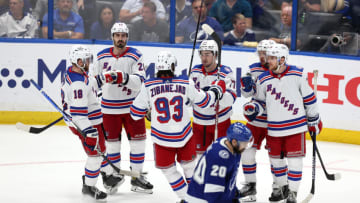 TAMPA, FLORIDA - JUNE 07: Artemi Panarin #10 of the New York Rangers celebrates with his teammates after scoring a goal on Andrei Vasilevskiy #88 of the Tampa Bay Lightning during the third period in Game Four of the Eastern Conference Final of the 2022 Stanley Cup Playoffs at Amalie Arena on June 07, 2022 in Tampa, Florida. (Photo by Mike Carlson/Getty Images)