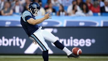 Noel Prefontaine #1 of the Toronto Argonauts punts the ball during CFL game action against the Saskatchewan Roughriders. (Photo by Tom Szczerbowski/Getty Images)