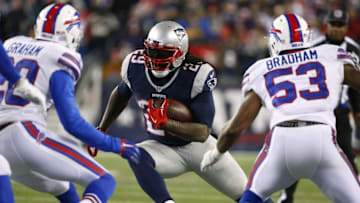 Nov 23, 2015; Foxborough, MA, USA; New England Patriots running back LeGarrette Blount (29) moves between Buffalo Bills free safety Corey Graham (20) and Buffalo Bills outside linebacker Nigel Bradham (53) during the second half at Gillette Stadium. Mandatory Credit: Winslow Townson-USA TODAY Sports