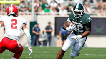 Michigan State running back Donovan Eaglin (32) rushes against Youngstown State defensive back Troy Jakubec (2) during the second half at Spartan Stadium in East Lansing on Saturday, Sept. 11, 2021.
