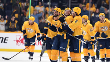 Jan 21, 2023; Nashville, Tennessee, USA; Nashville Predators left wing Cole Smith (36) and center Cody Glass (8) celebrate after a win against the Los Angeles Kings at Bridgestone Arena. Mandatory Credit: Christopher Hanewinckel-USA TODAY Sports