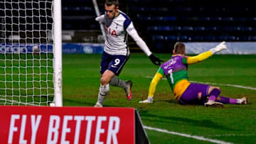 Tottenham Hotspur's Welsh striker Gareth Bale (R) celebrates after scoring their first goal during the English FA Cup fourth round football match between Wycombe Wanderers and Tottenham Hotspur at Adams Park Stadium in High Wycombe, west of London on January 25, 2021. (Photo by ADRIAN DENNIS/AFP via Getty Images)