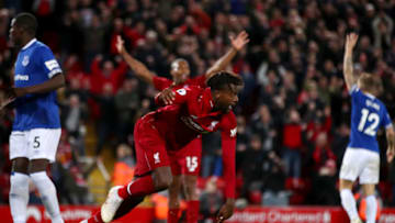 LIVERPOOL, ENGLAND - DECEMBER 02: Divock Origi of Liverpool celebrates after scoring his team's first goal during the Premier League match between Liverpool FC and Everton FC at Anfield on December 2, 2018 in Liverpool, United Kingdom. (Photo by Clive Brunskill/Getty Images)