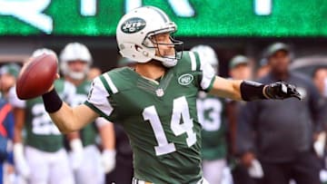 Dec 27, 2015; East Rutherford, NJ, USA; New York Jets quarterback Ryan Fitzpatrick (14) throws a pass during the first half of their game against the New England Patriots at MetLife Stadium. Mandatory Credit: Ed Mulholland-USA TODAY Sports