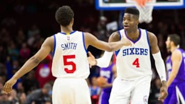 Mar 13, 2015; Philadelphia, PA, USA; Philadelphia 76ers center Nerlens Noel (4) celebrates his score with guard Ish Smith (5) during the second half at Wells Fargo Center. The 76ers won 114-107. Mandatory Credit: Bill Streicher-USA TODAY Sports