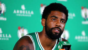 CANTON, MA - SEPTEMBER 24: Kyrie Irving #11 answers questions during a press conference on Boston Celtics Media Day on September 24, 2018 in Canton, Massachusetts. NOTE TO USER: User expressly acknowledges and agrees that, by downloading and/or using this photograph, user is consenting to the terms and conditions of the Getty Images License Agreement. (Photo by Maddie Meyer/Getty Images)