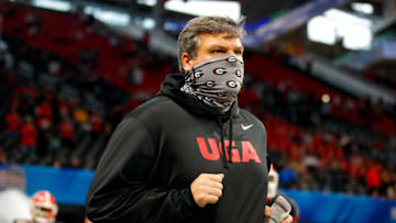 ATLANTA, GA - JANUARY 01: Offensive line coach Matt Luke of the Georgia Bulldogs runs onto the field prior to the Chick-fil-A Peach Bowl against the Cincinnati Bearcats at Mercedes-Benz Stadium on January 1, 2021 in Atlanta, Georgia. (Photo by Todd Kirkland/Getty Images)
