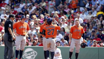 Aug 17, 2014; Boston, MA, USA; Houston Astros second baseman Jose Altuve (27) touches home plate after hitting a grand-slam against the Boston Red Sox during the second inning at Fenway Park. Mandatory Credit: David Butler II-USA TODAY Sports