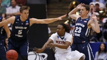 Mar 17, 2015; Dayton, OH, USA; Mississippi Rebels guard Stefan Moody (42) passes the ball while guarded by Brigham Young Cougars guard Kyle Collinsworth (5) during the first half in the first round of the 2015 NCAA Tournament at UD Arena. Mandatory Credit: Rick Osentoski-USA TODAY Sports