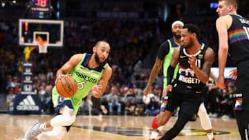 DENVER, CO - FEBRUARY 23: Jordan McLaughlin #6 of the Minnesota Timberwolves drives to the basket against Monte Morris #11 of the Denver Nuggets at Pepsi Center on February 23, 2020 in Denver, Colorado. NOTE TO USER: User expressly acknowledges and agrees that, by downloading and or using this photograph, User is consenting to the terms and conditions of the Getty Images License Agreement. (Photo by Justin Tafoya/Getty Images)