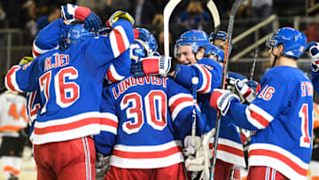 Sep 26, 2019; New York, NY, USA; The New York Rangers celebrate after a game-winning goal by center Mika Zibanejad (93) during a shootout against the Philadelphia Flyers at Madison Square Garden. Mandatory Credit: Sarah Stier-USA TODAY Sports