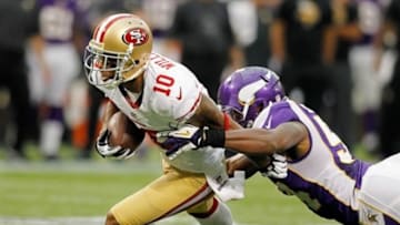 Sep 23, 2012; Minneapolis, MN, USA; San Francisco 49ers wide receiver Kyle Williams (10) gains 7 yards on a pass as Minnesota Vikings linebacker Jasper Brinkley (54) tackles him in the second quarter at the Metrodome. Vikings win 24-13. Mandatory Credit: Bruce Kluckhohn-USA TODAY Sports