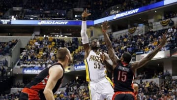 Jan 7, 2014; Indianapolis, IN, USA; Indiana Pacers center Roy Hibbert (55) takes a shot against Toronto Raptors forward Amir Johnson (15) at Bankers Life Fieldhouse. Indiana defeats Toronto 86-79. Mandatory Credit: Brian Spurlock-USA TODAY Sports