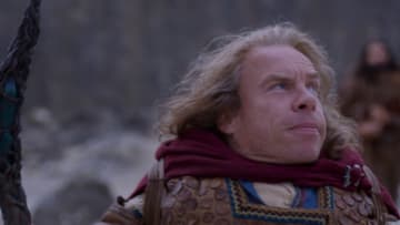 (L-R): Willow Ufgood (Warwick Davis) and Boorman (Amar Chadha-Patel) in Lucasfilm's WILLOW exclusively on Disney+. ©2022 Lucasfilm Ltd. & TM. All Rights Reserved.