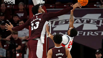 Jan 7, 2023; Starkville, Mississippi, USA; Mississippi State Bulldogs forward Will McNair Jr. (13) blocks the shot of Mississippi Rebels guard Daeshun Ruffin (24) during the second half at Humphrey Coliseum. Mandatory Credit: Petre Thomas-USA TODAY Sports