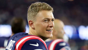 FOXBOROUGH, MASSACHUSETTS - AUGUST 11: Mac Jones #10 of the New England Patriots looks on from the sideline during the preseason game between the New York Giants and the New England Patriots at Gillette Stadium on August 11, 2022 in Foxborough, Massachusetts. (Photo by Maddie Meyer/Getty Images)